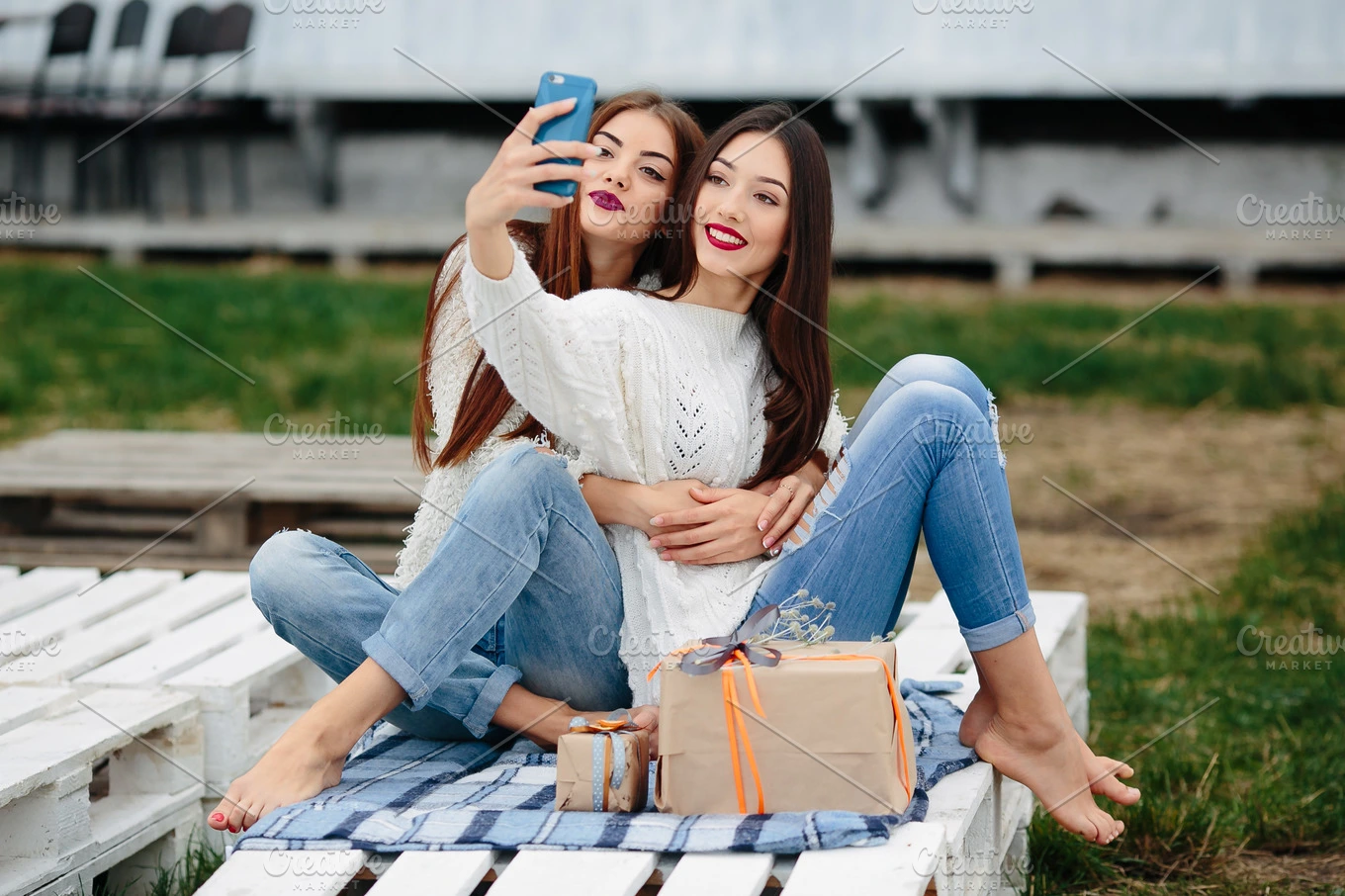 Two girls make selfie with gifts | High-Quality People Images