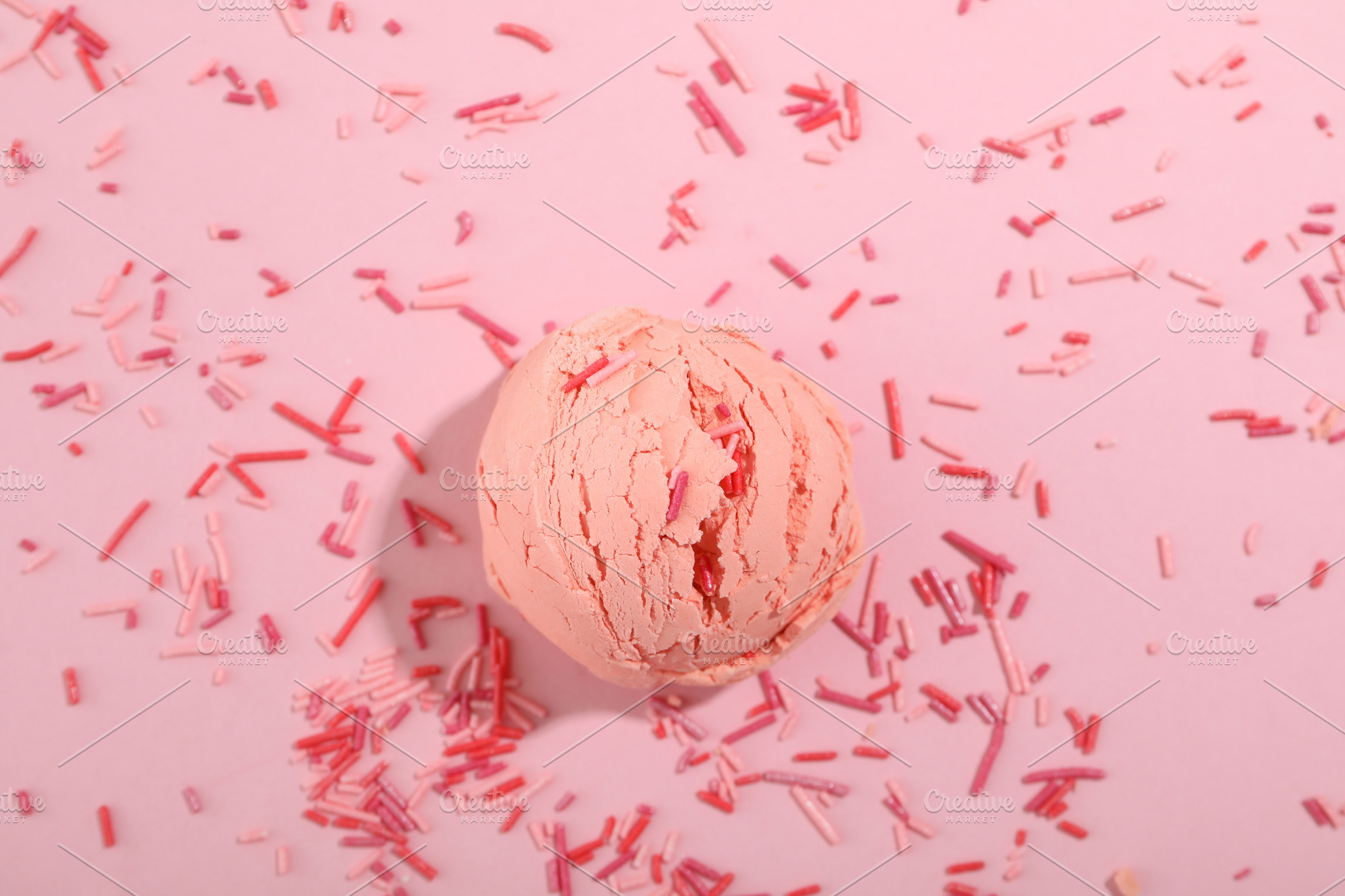 Ice cream scoop and sprinkles on pink background | Food Images