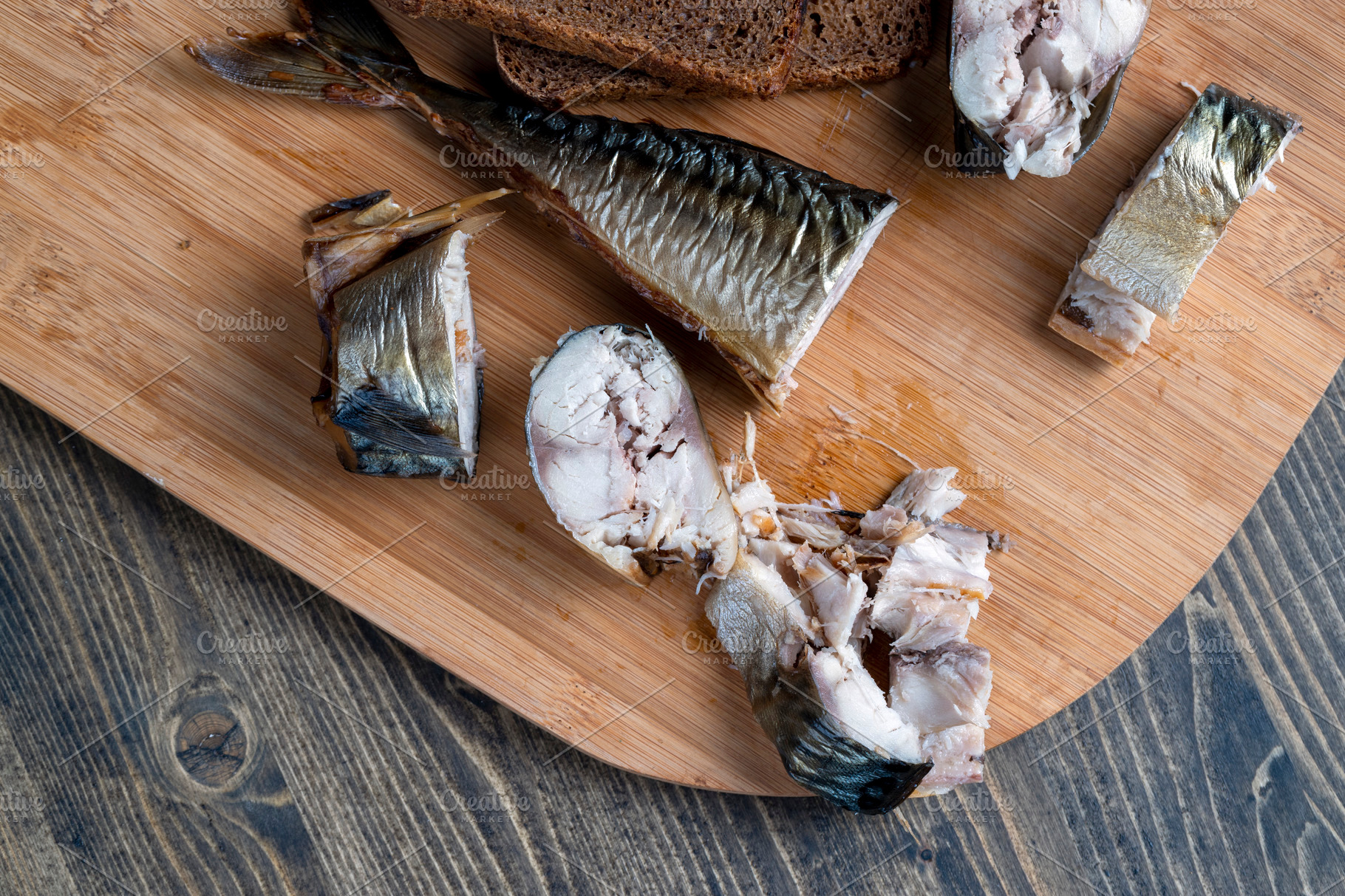 cut-into-pieces-of-smoked-mackerel-during-cooking-stock-photos