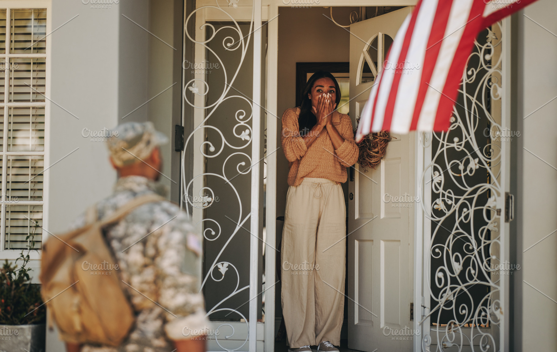 Surprised military wife welcoming her husband from the army Peo