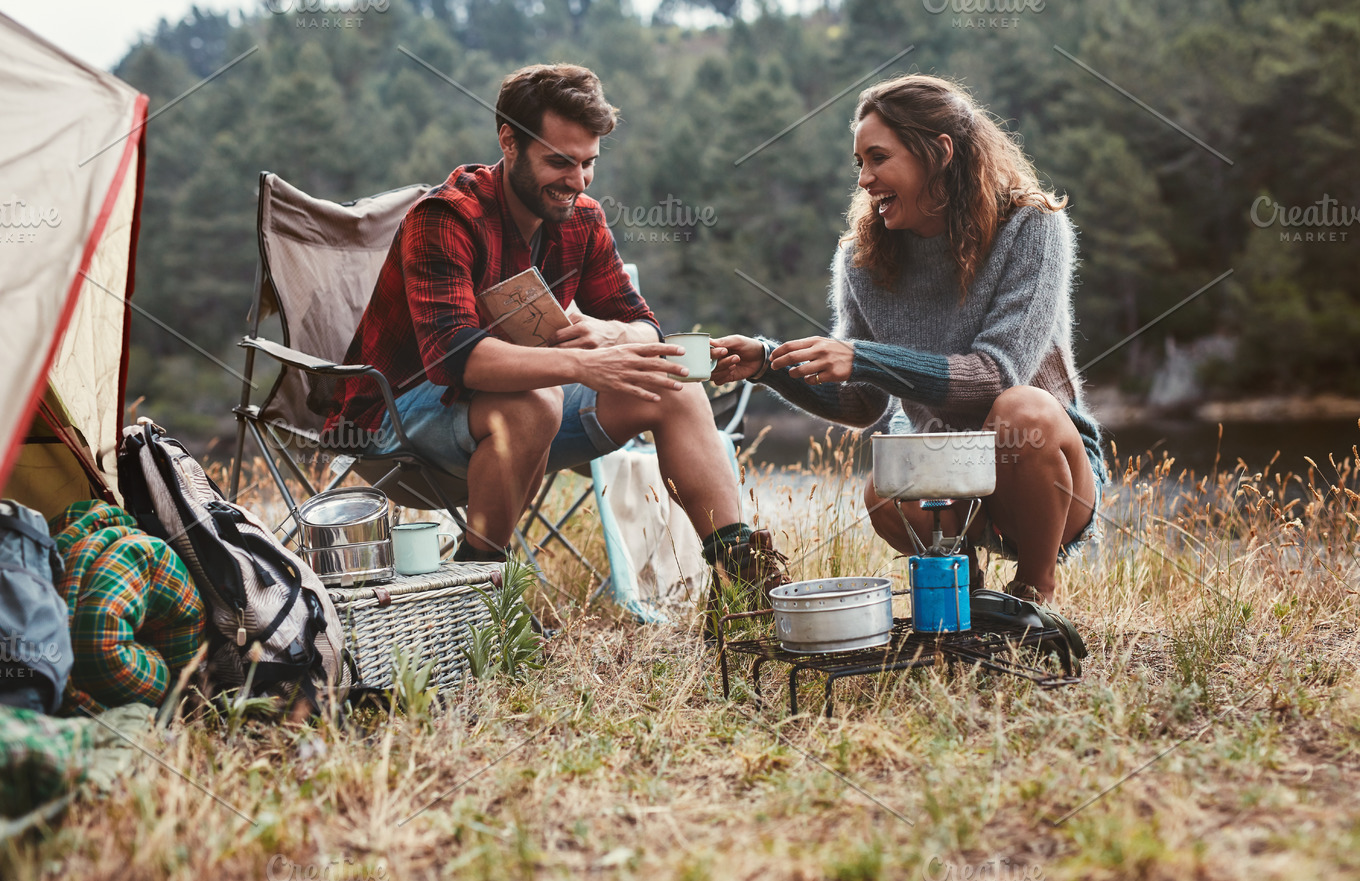 Happy young couple camping | High-Quality People Images ~ Creative Market