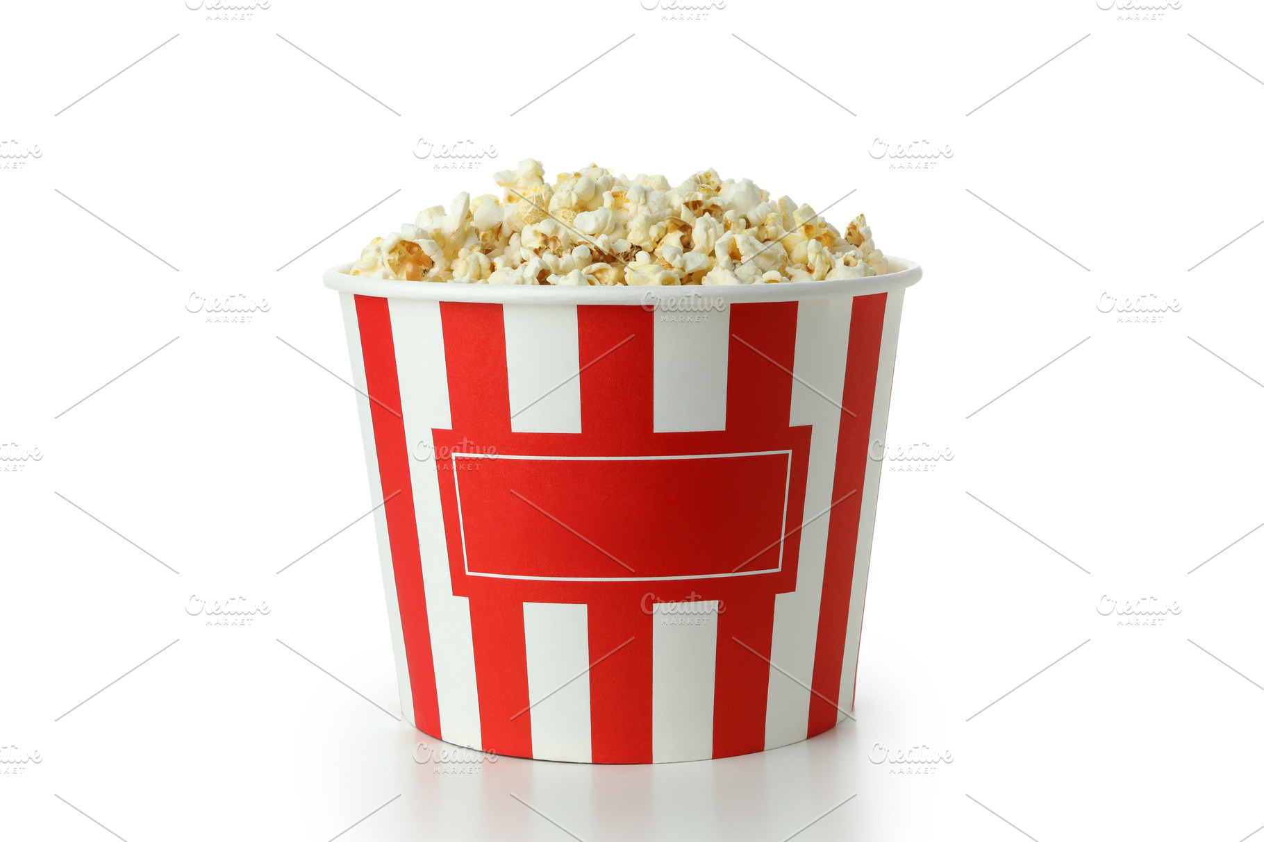 Striped paper cup with popcorn isolated on white background | Food