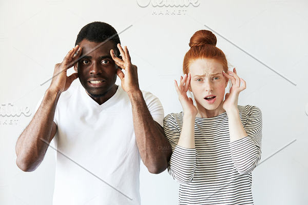 Close Up Shot Of Black Male And White Female Posing Isolated Against