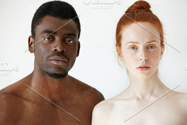 Portrait Of Shocked Interracial Couple African Man And Redhead