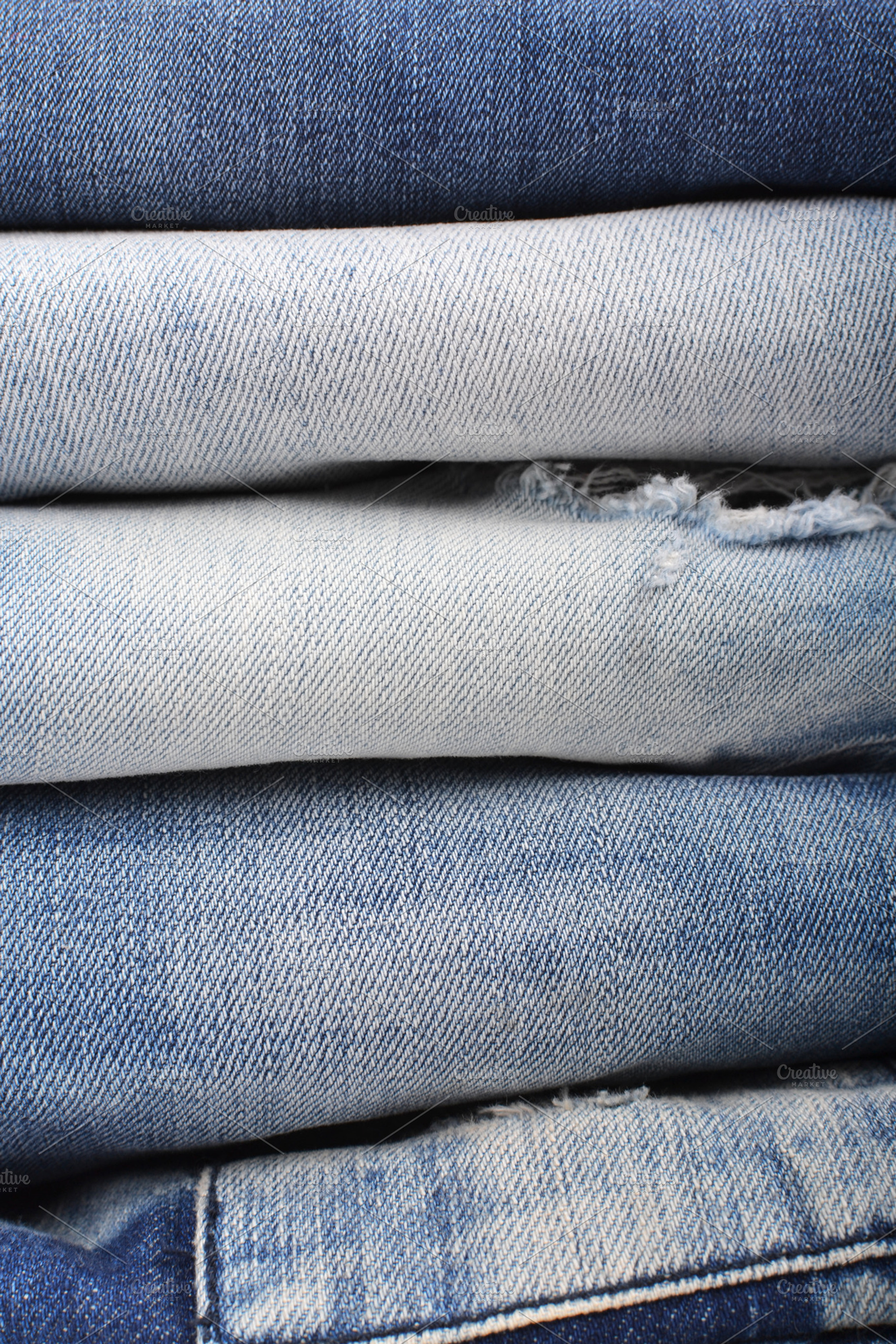 Stack of folded jeans containing jeans, denim, and fabric | High ...