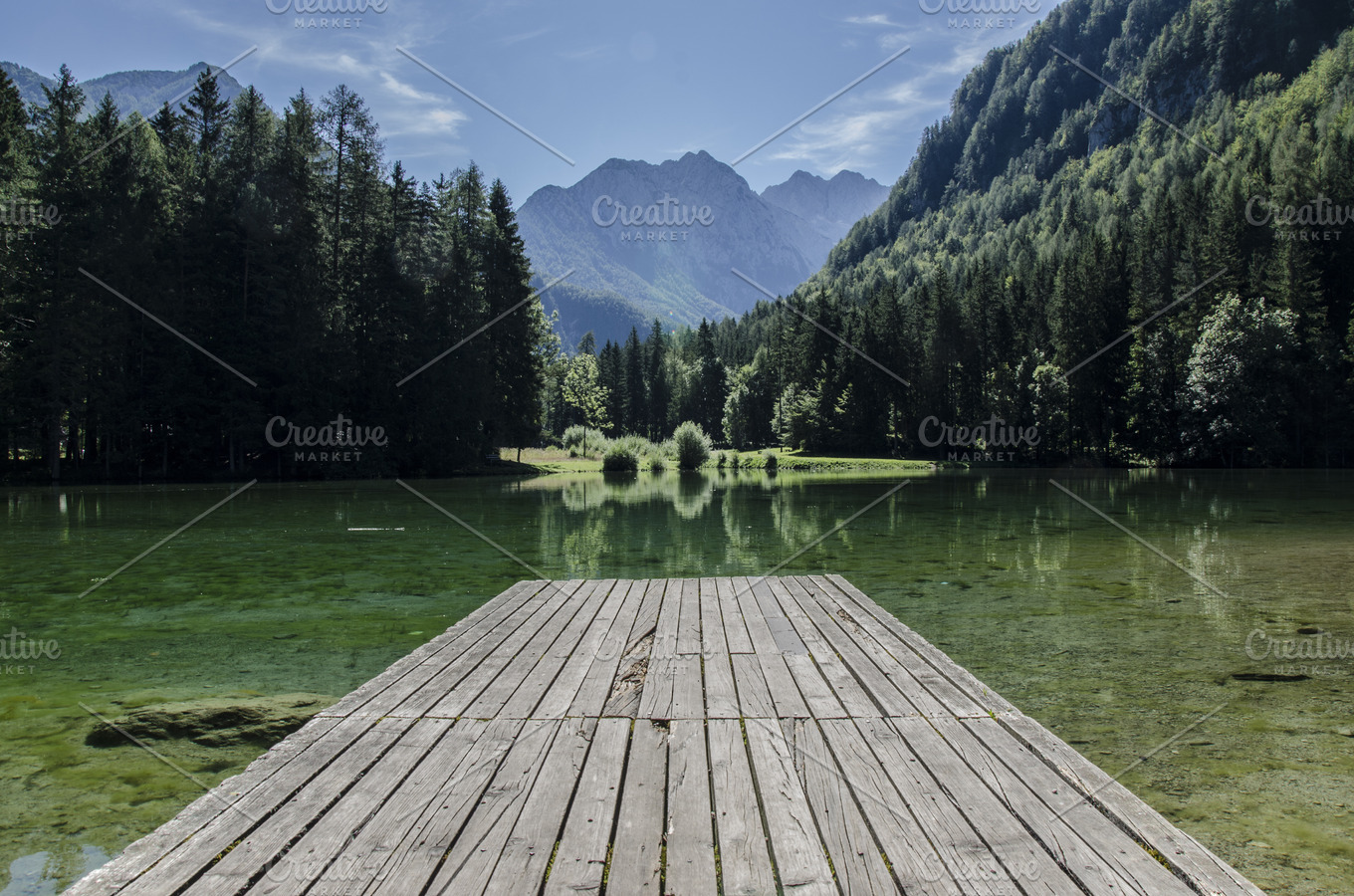 Wooden pier on the lake featuring mountains, sky, and forest | Nature ...