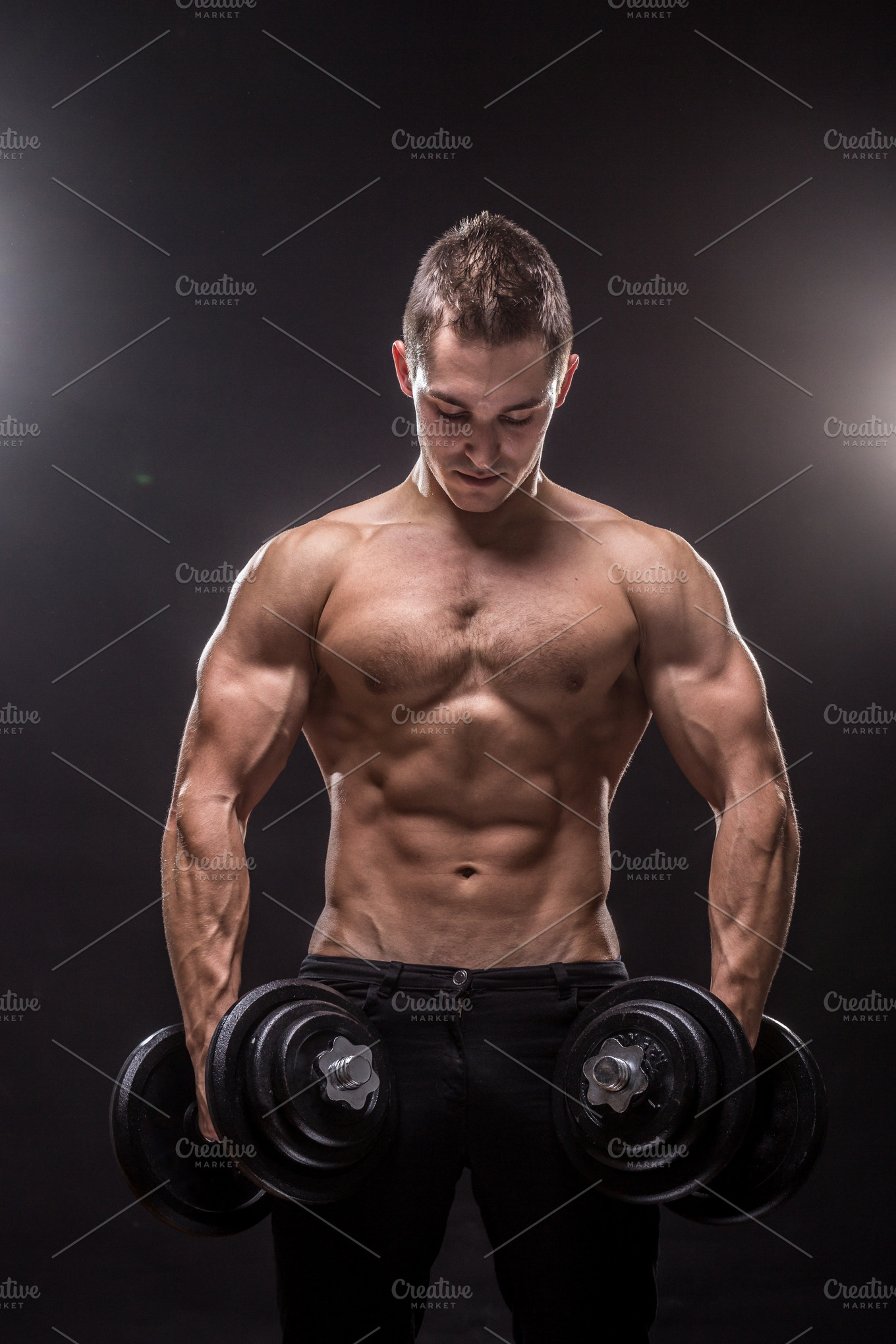 Bodybuilder strong muscular posing | High-Quality Sports Stock Photos