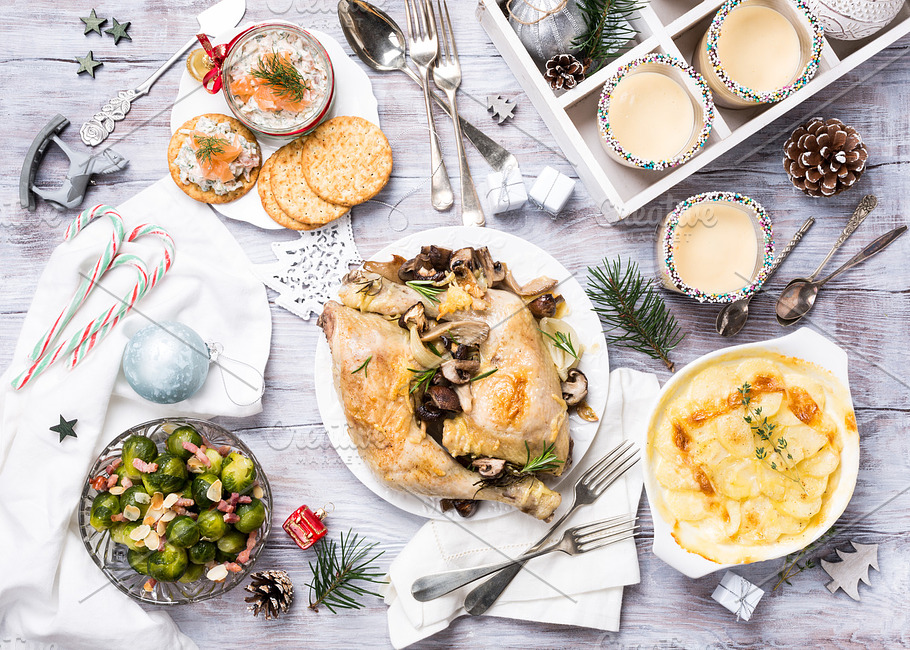 Christmas themed dinner table containing christmas, dinner, and table