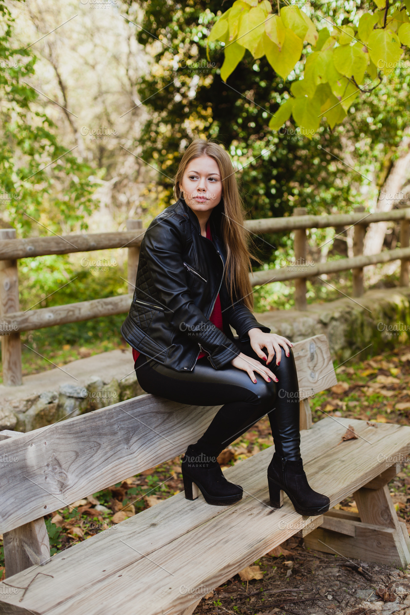 Blonde girl in a park at autumn featuring bench, forest, and nature ...