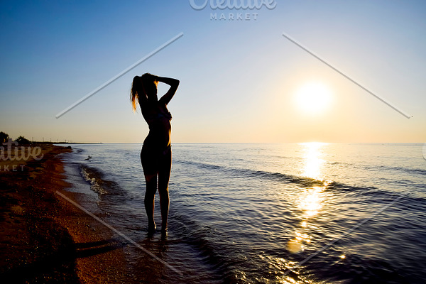 Silhouette Of A Girl Against The Sunset By The Sea Containing Girl Sunset High Quality Beauty Fashion Stock Photos Creative Market