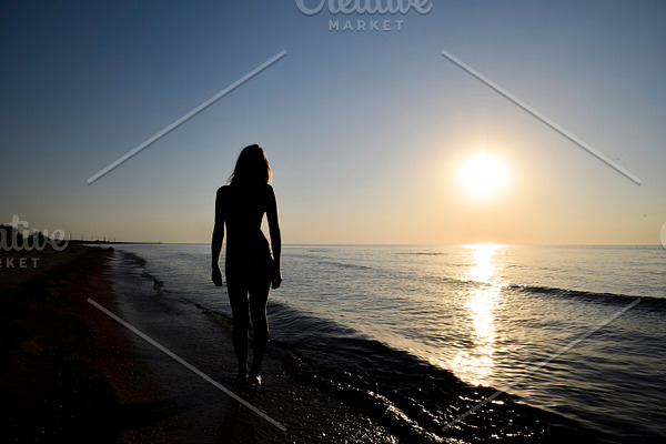 Silhouette Of A Girl Against The Sunset By The Sea Containing Girl Sunset High Quality Beauty Fashion Stock Photos Creative Market