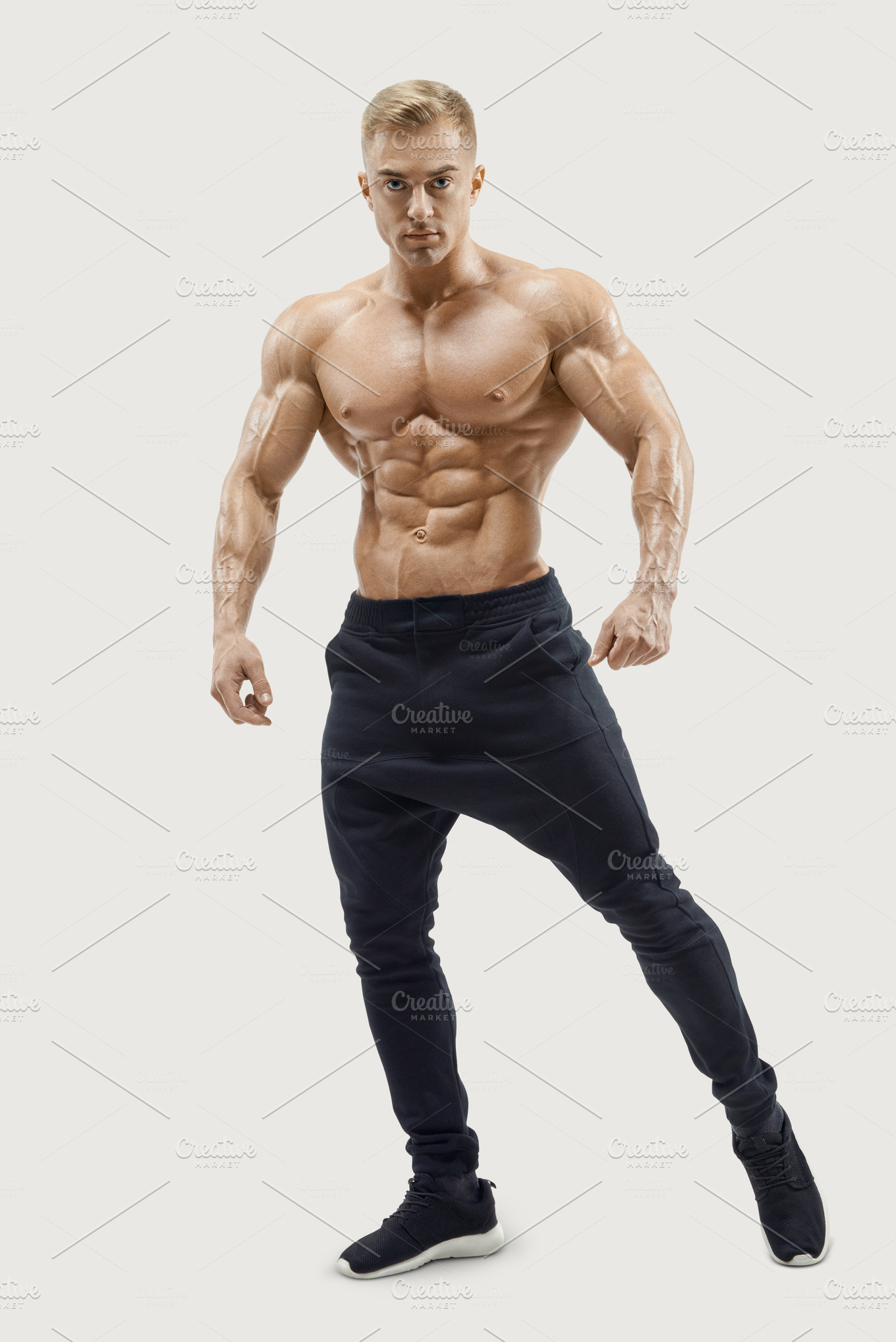 Young fitness male model posing | High-Quality Sports Stock Photos