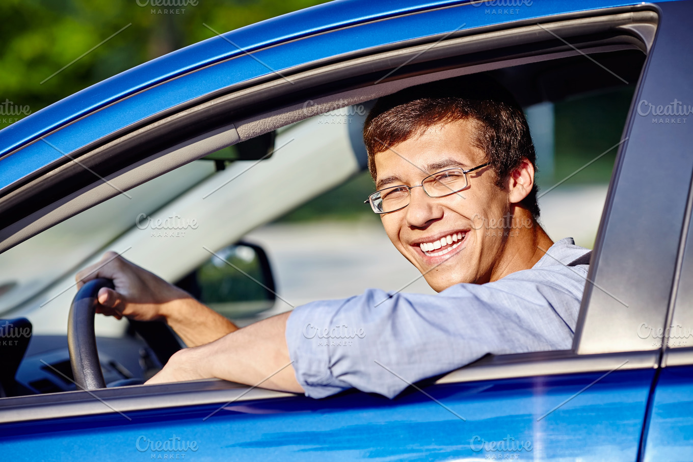 Guy in car closeup stock photo containing car rental and cheerful