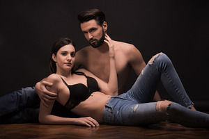 Young couple lying bra sexy romantic stock photo containing black