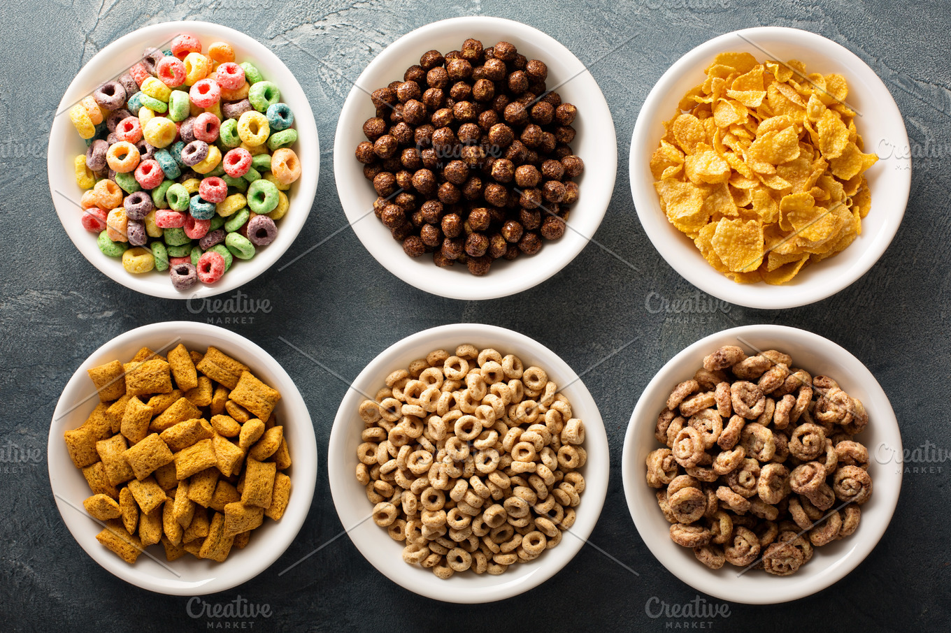 Variety of cold cereals in white bowls stock photo containing variety