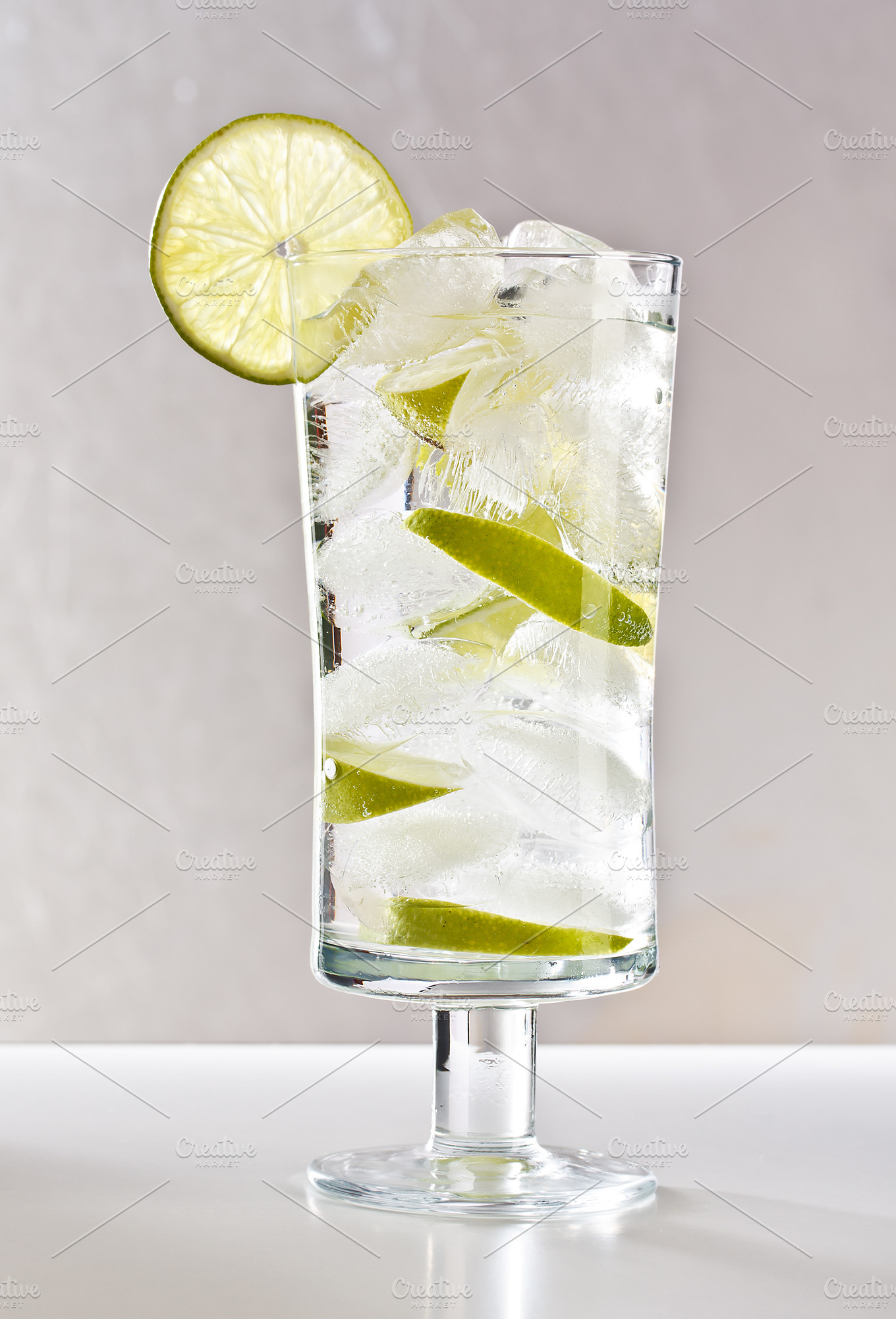 Vodka with lime, ice and soda | High-Quality Food Images ~ Creative Market