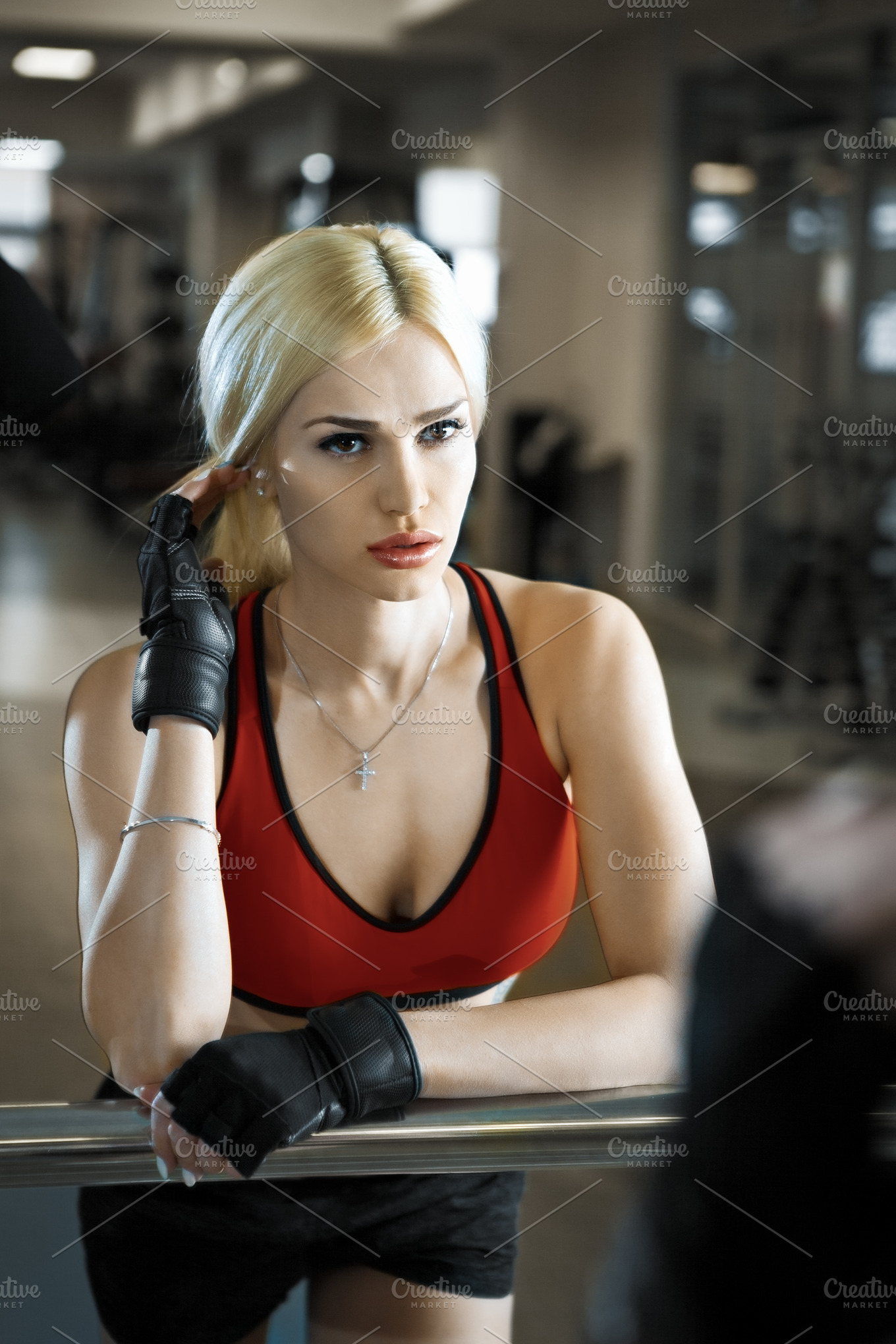 Portrait Of A Beautiful Sexy Woman Dressed In Sports Clothes In The Gym Sports And Recreation