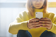 Girl typing messages on phone | Technology Stock Photos ~ Creative Market