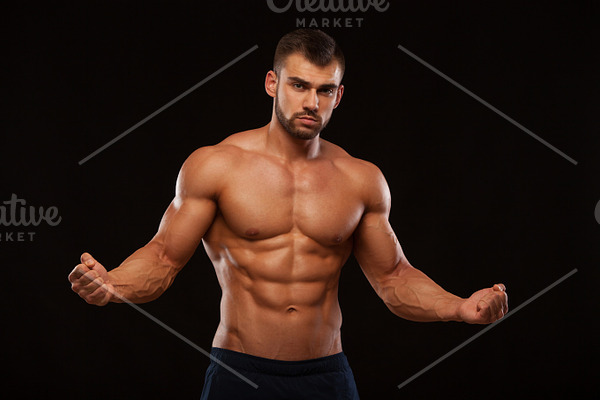 Strong athletic man fitness model torso showing six pack abs isolated ...