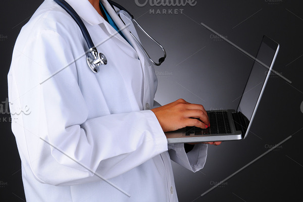 Nurse holding tablet computer featuring nurse, doctor, and medicine