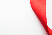 Background of red fabric ribbon. Isolated. Copy space. | Arts