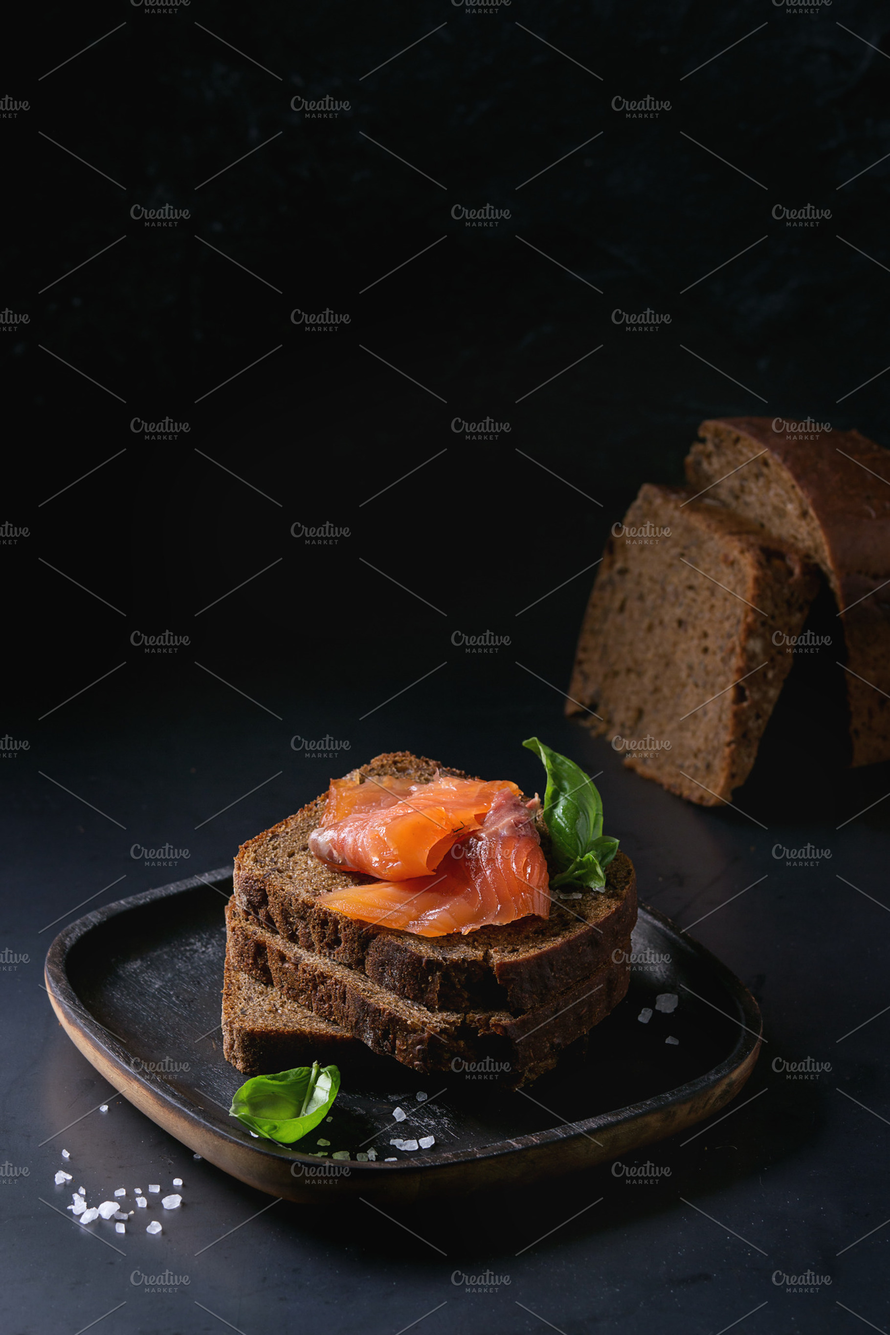 Rye bread with smoked salmon containing salmon, bread, and smoked ...