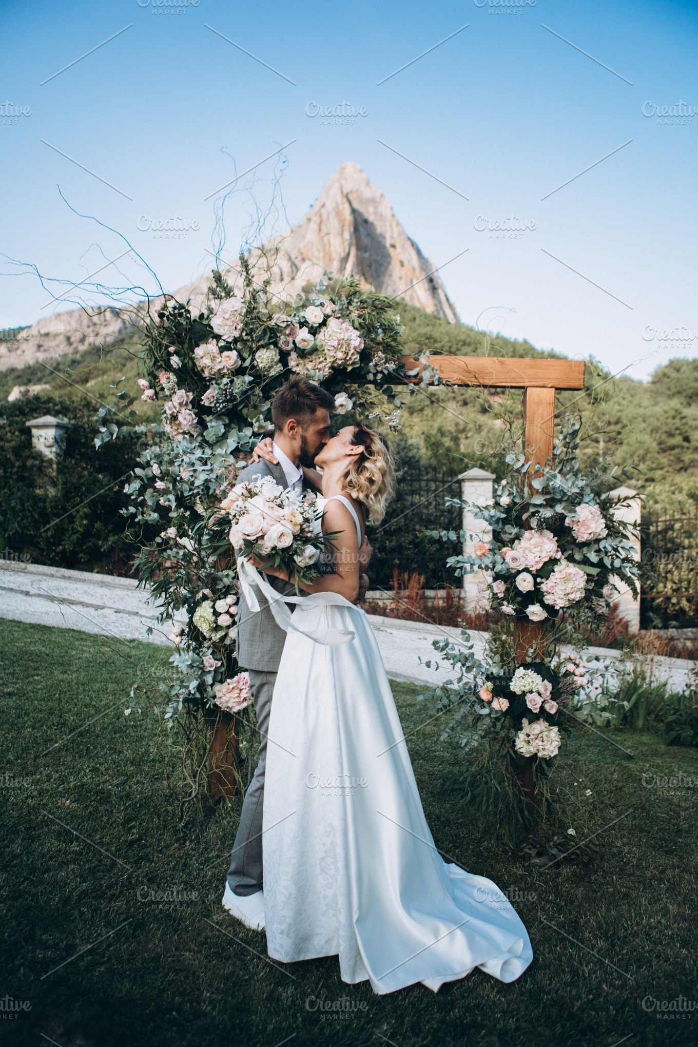 Wedding couple kiss on ceremony | High-Quality People Images ~ Creative