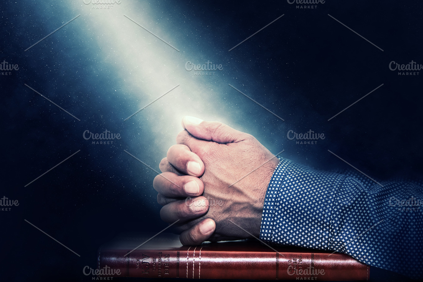 Hands Folded In Prayer On A Bible High Quality Stock Photos