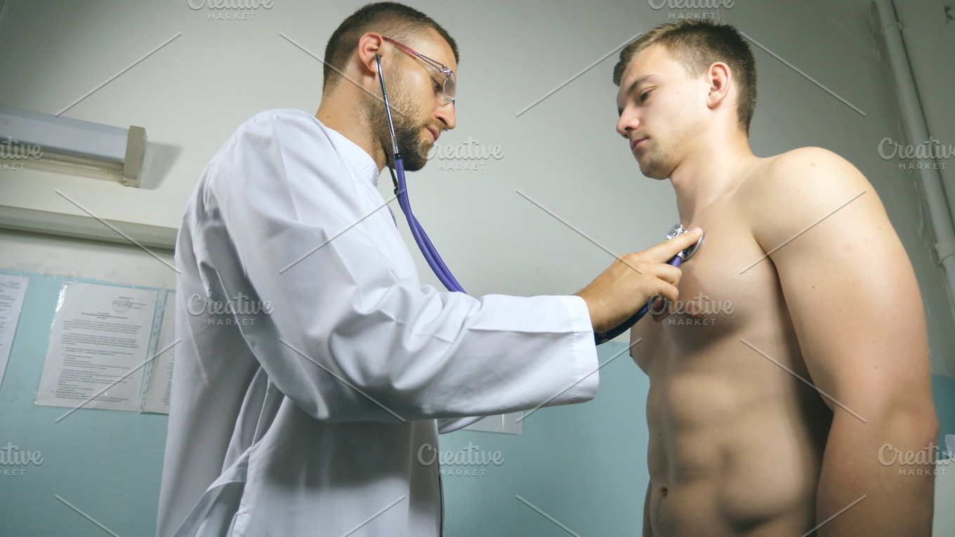 Doctor Examining Young Male Patient With Stethoscope Medical Worker Listening Health And Medical 1702