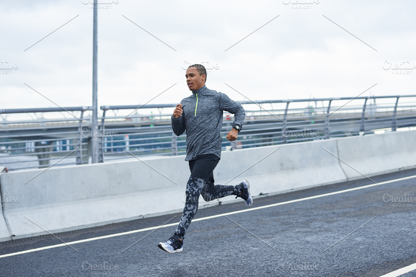 Black male runner exercising outdoors. Handsome fashionable young Afro ...