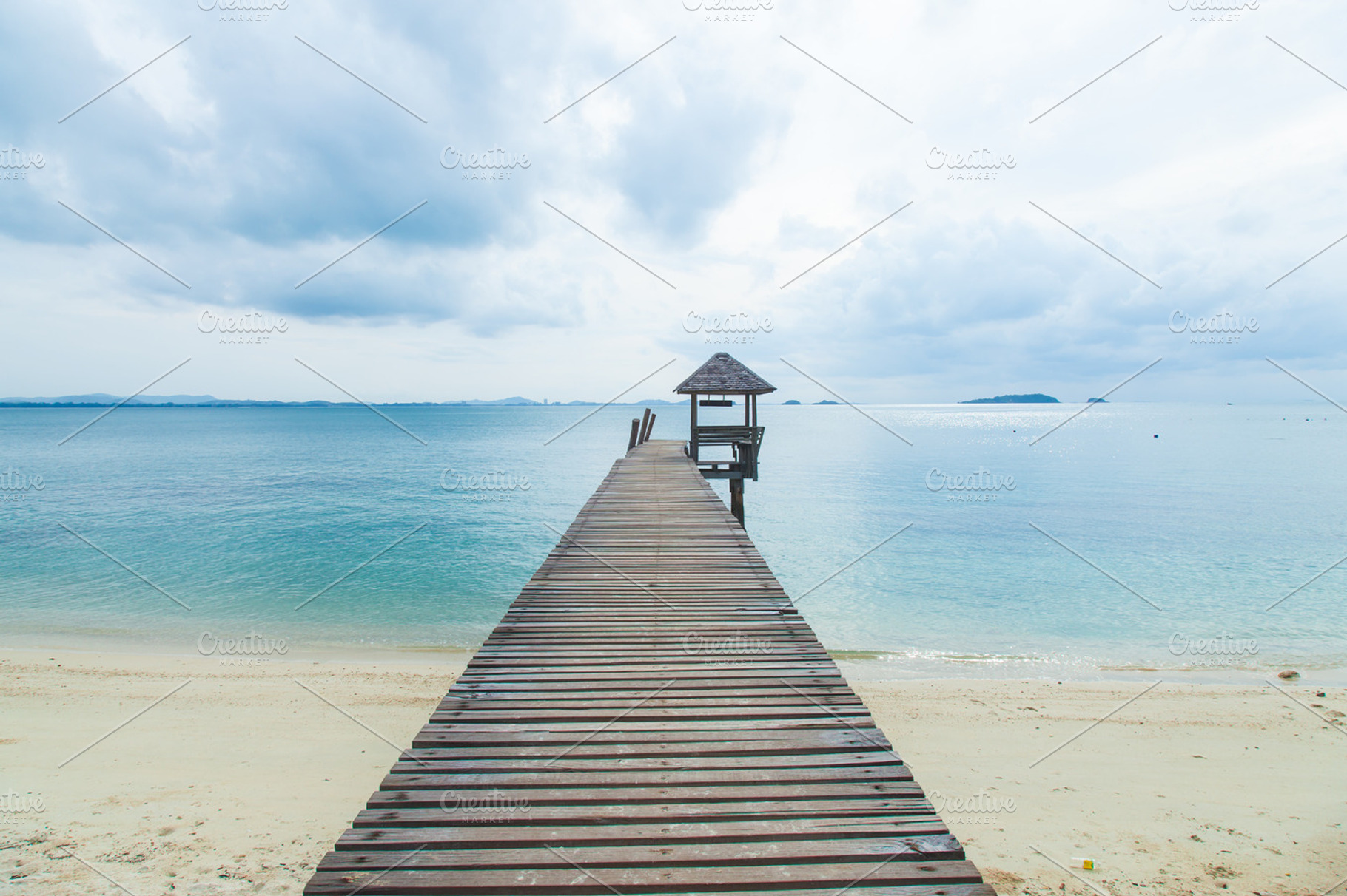 Wooden bridge into the sea containing bridge, wooden, and sea | High