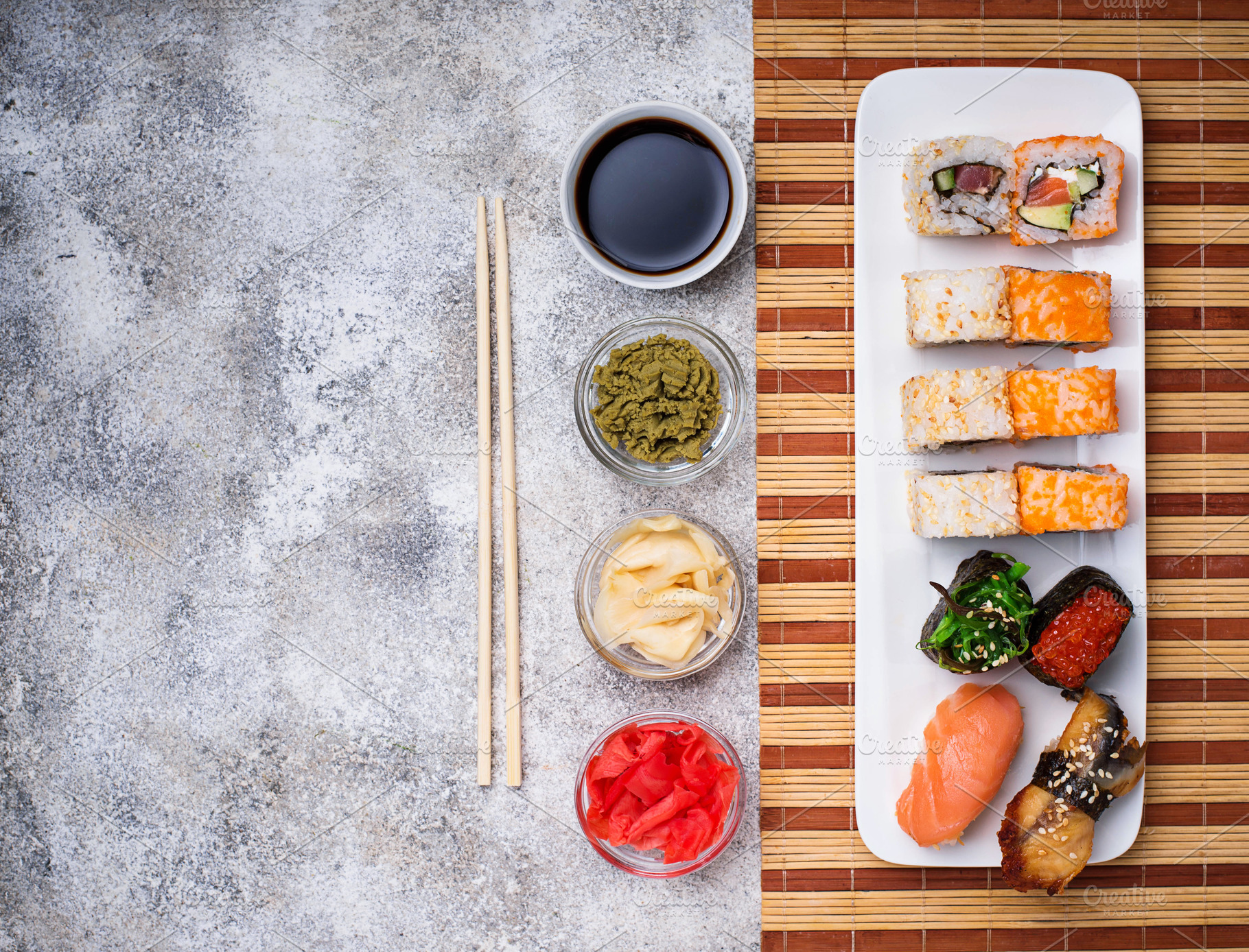 Sushi roll set with wasabi, ginger and soy sauce . Stock Photo by