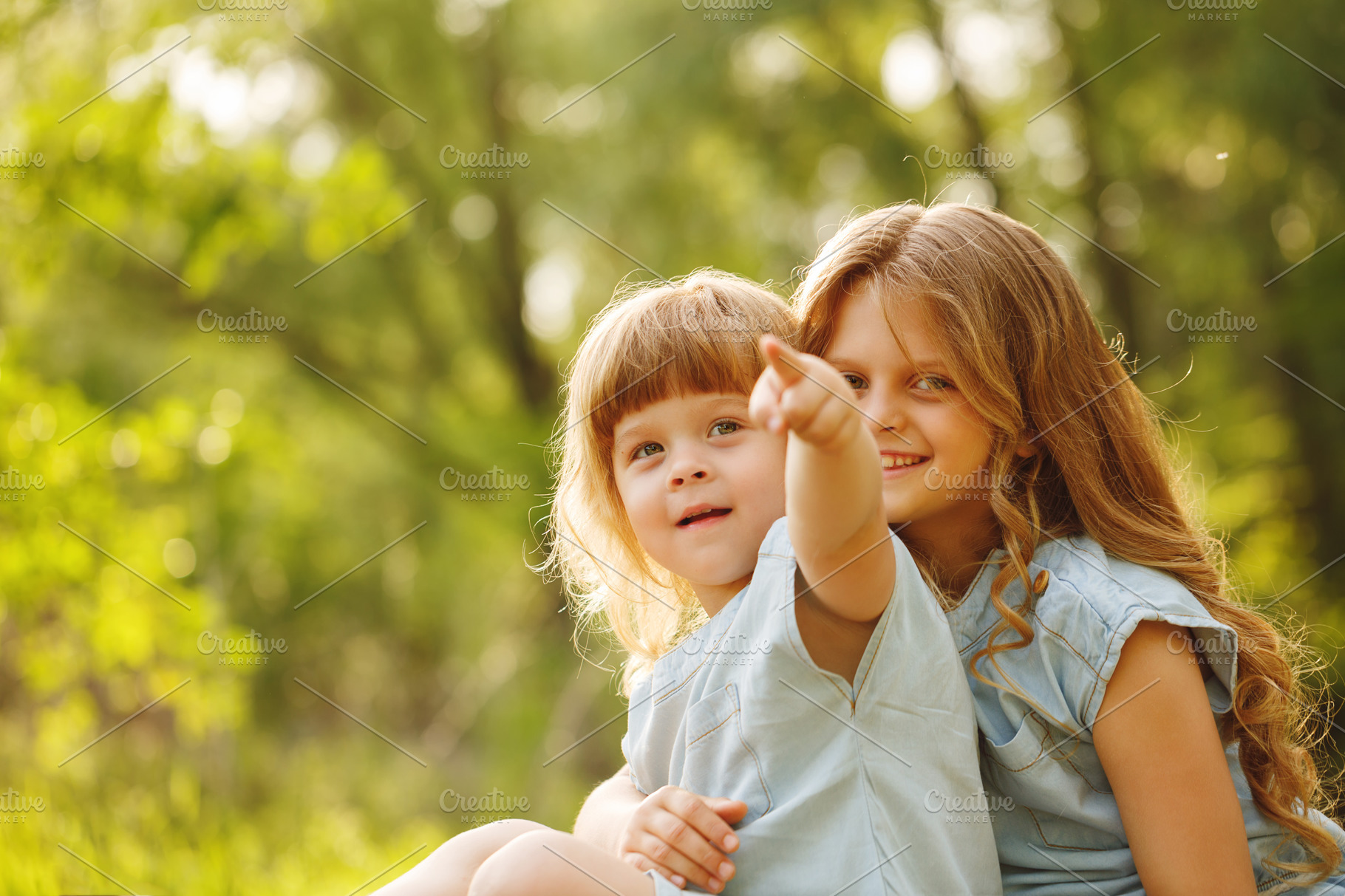 Two little sisters cuddling. Family | People Images ~ Creative Market