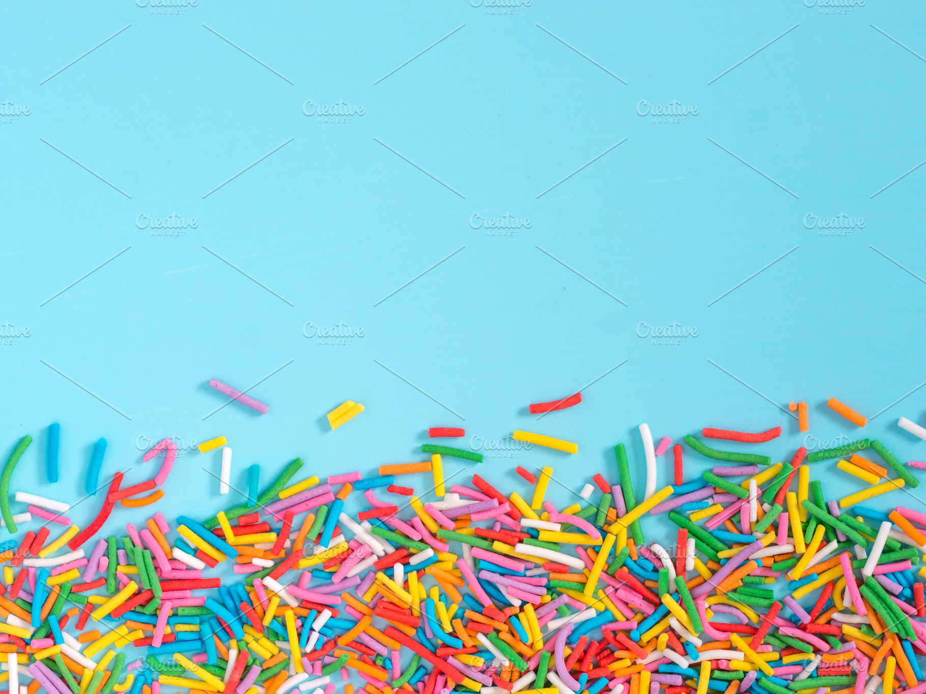 Border frame of colorful sprinkles featuring sweet, confetti, and candy