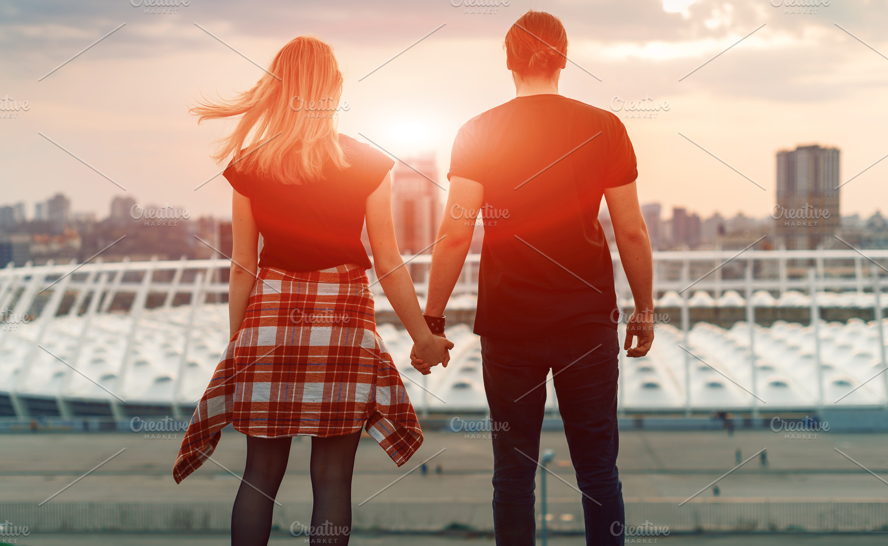 A Boy With A Girl Taking Hands On His Hands Watching The Sunset In The Evening City Silhouette Of Lovers Against The Background Of The City High Quality Stock Photos Creative