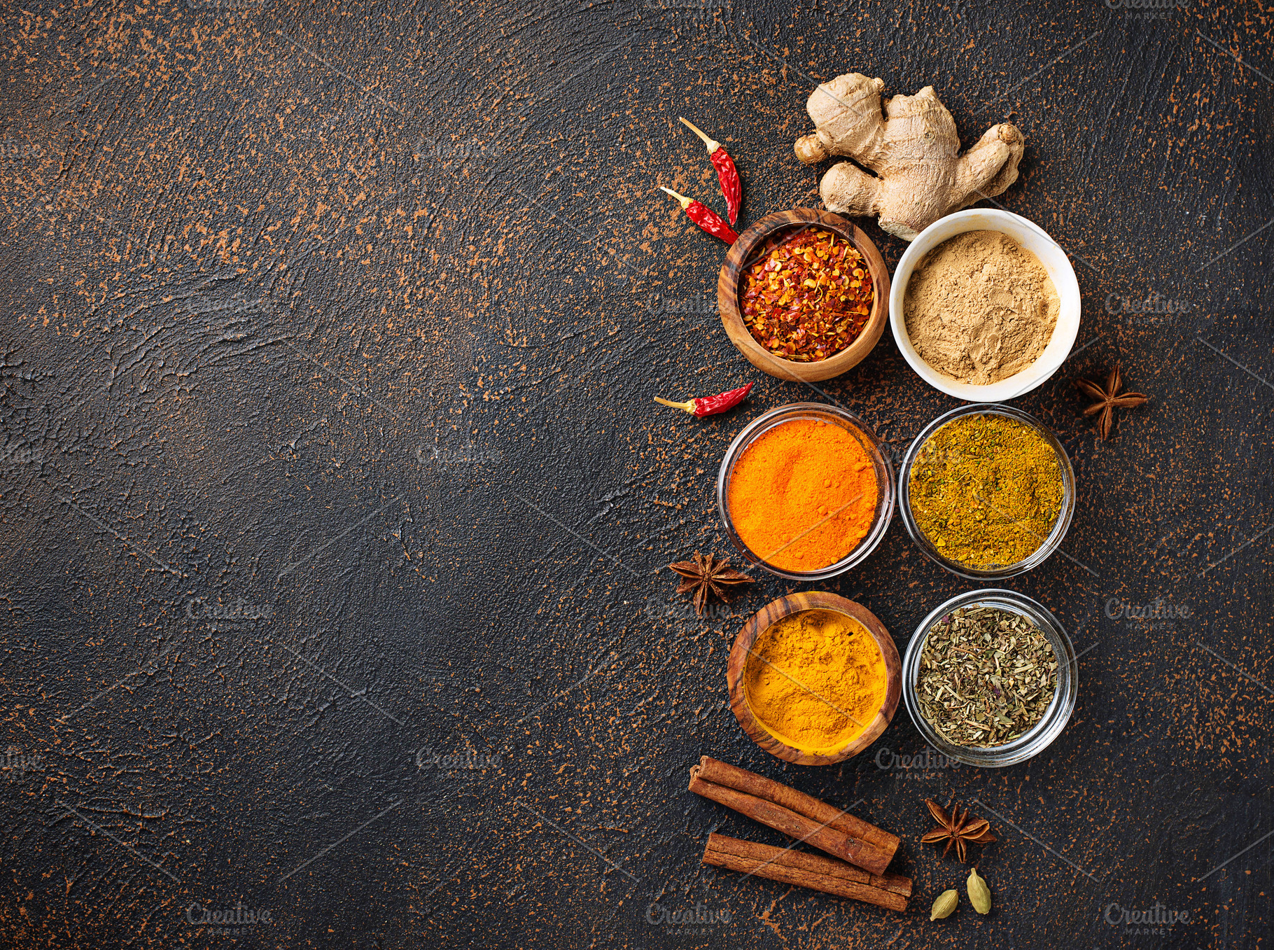 Traditional indian spices on rusty background featuring paprika