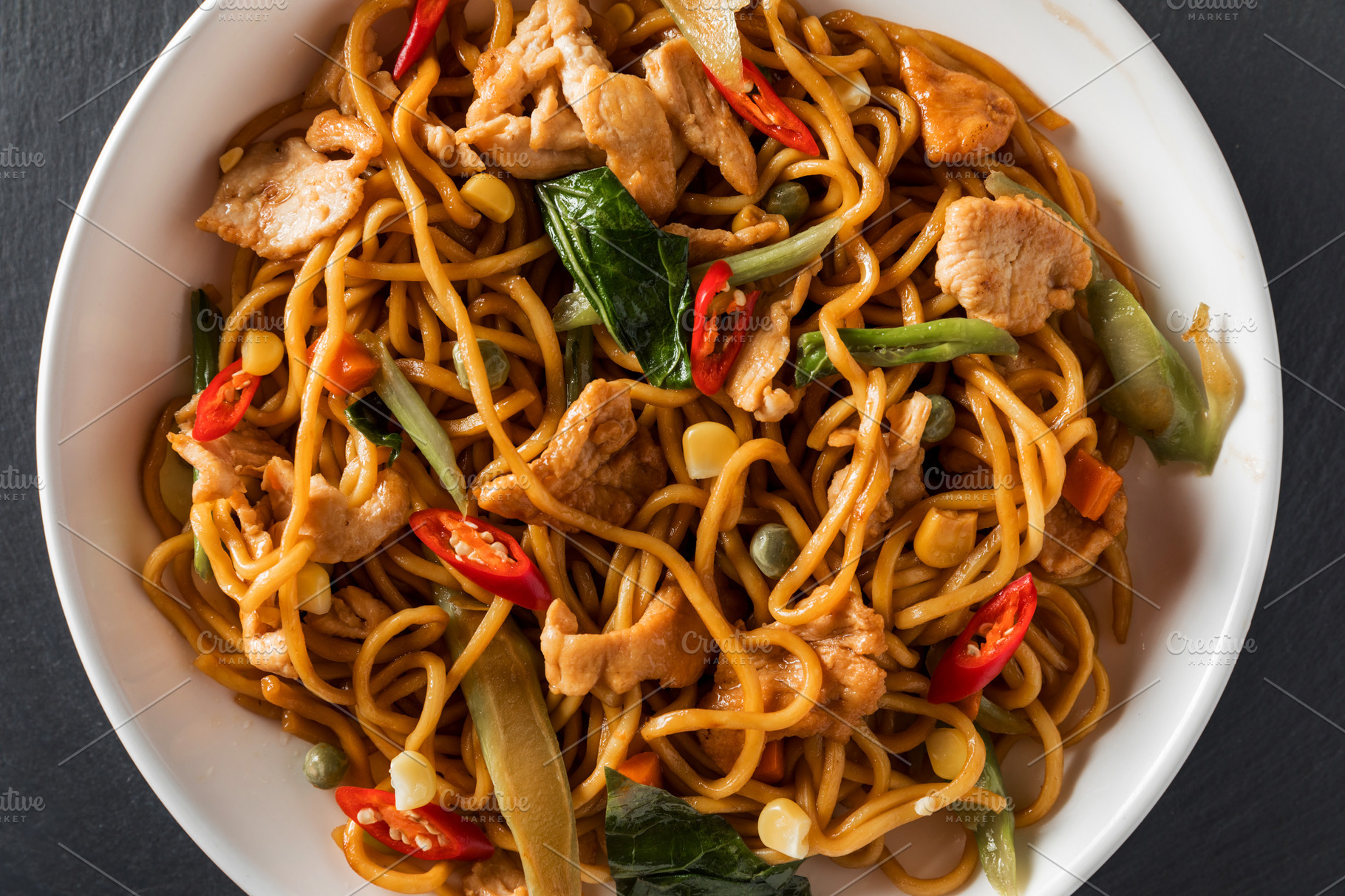 Wok stirfry egg noodles with fried containing asian, background, and