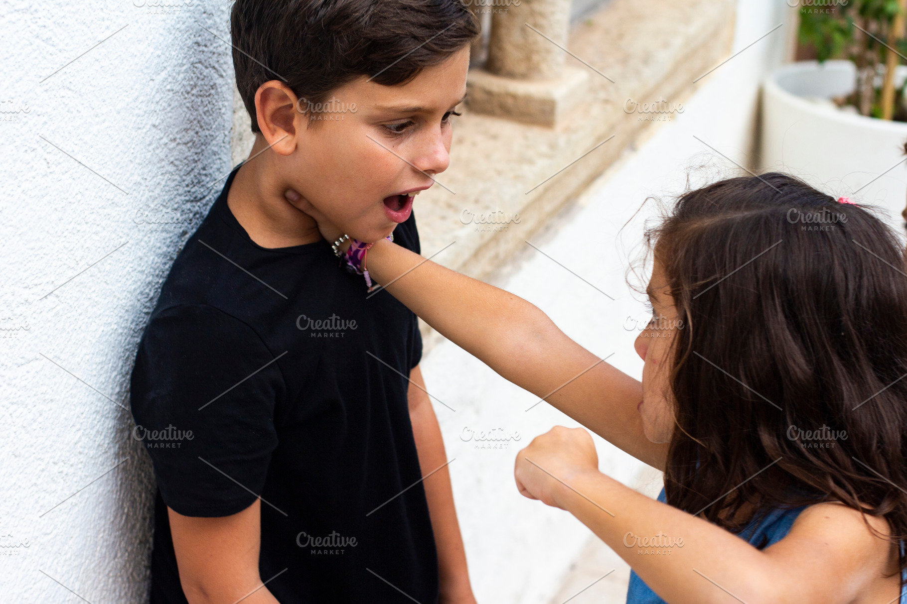 Little kid hitting another child. HighQuality People Images