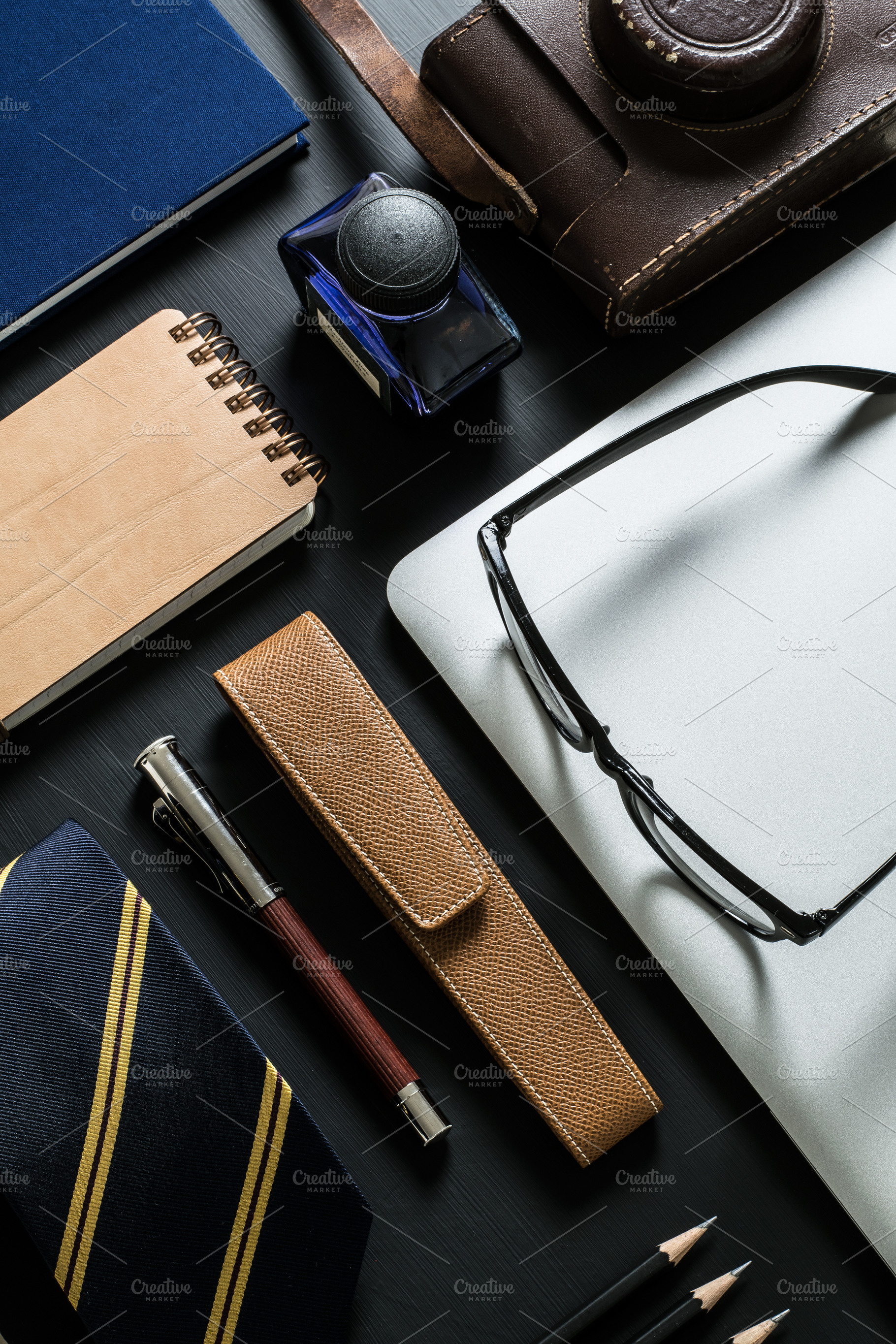 Blue and brown men's items vi containing desk, business, and technology ...