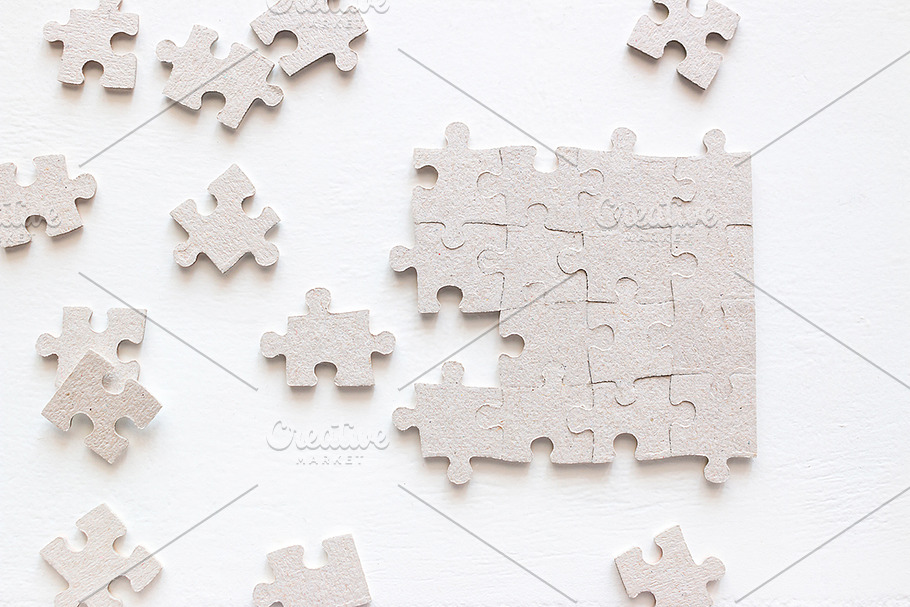 puzzle pieces on black background | High-Quality Business Images