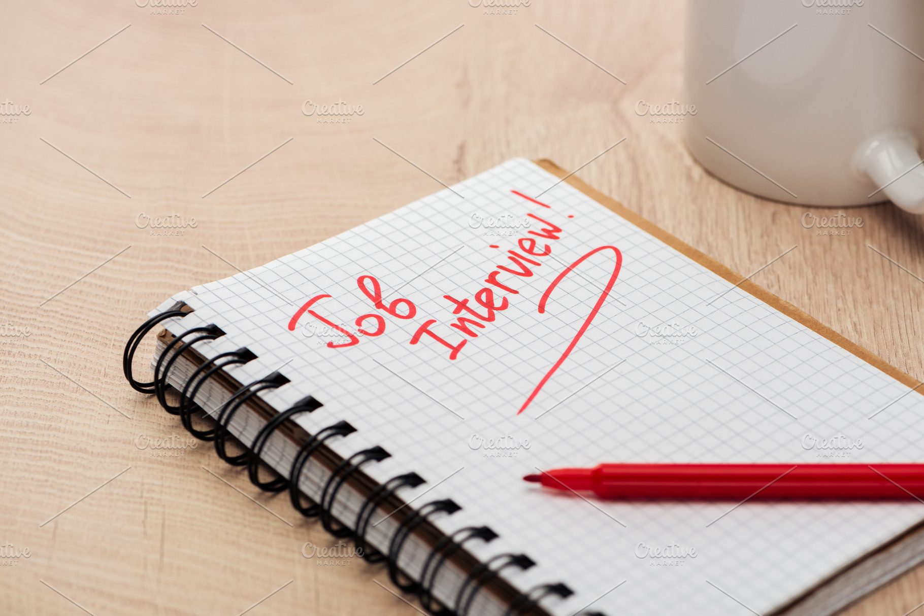 Notebook with job interview letterin featuring table, red, and