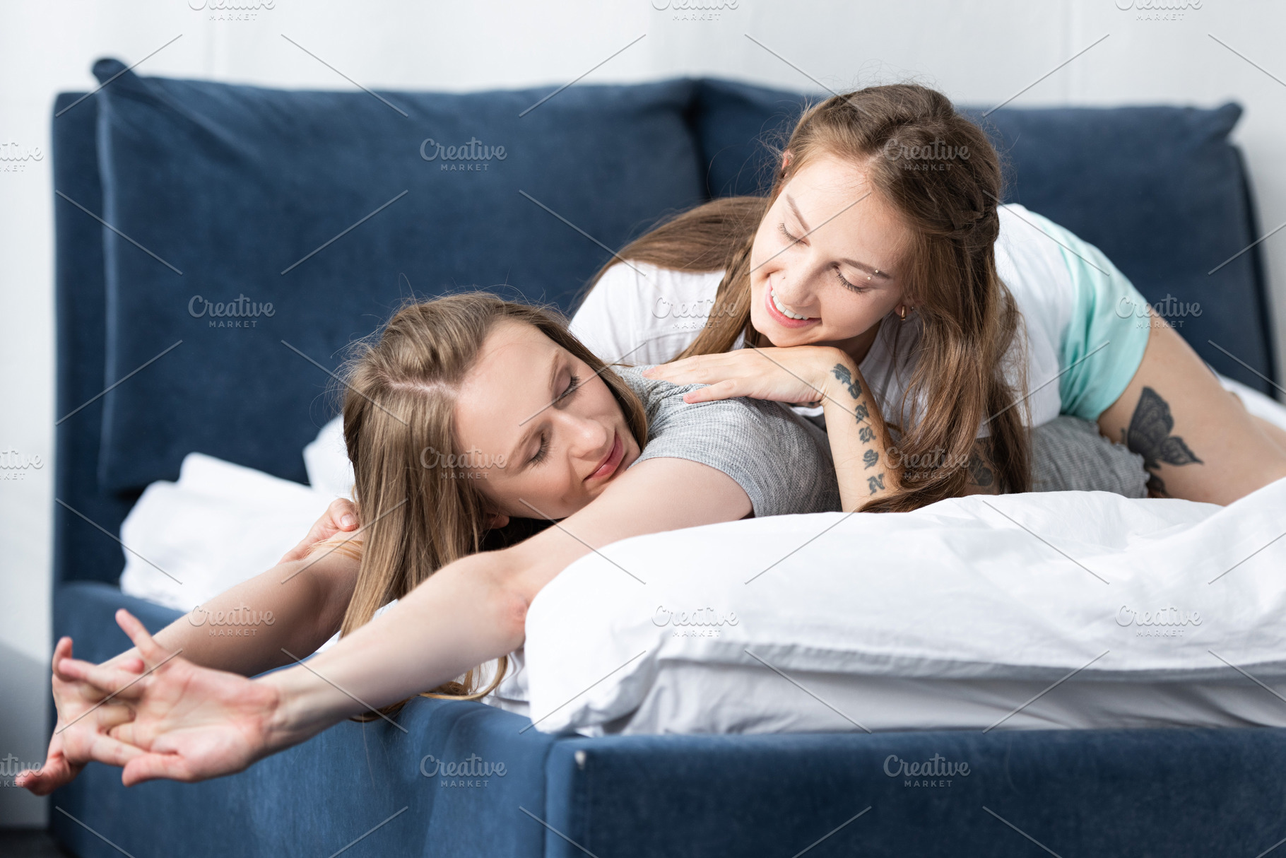 Two Smiling Lesbians Lying On Bed In High Quality People Images Creative Market