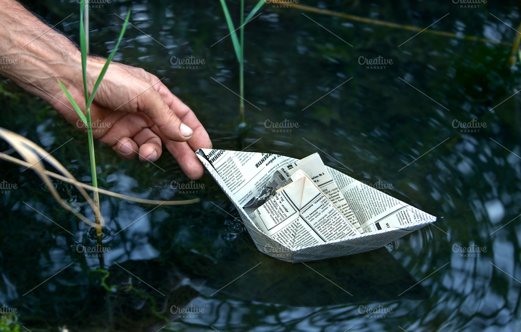 Paper boat on the river | Stock Photos ~ Creative Market