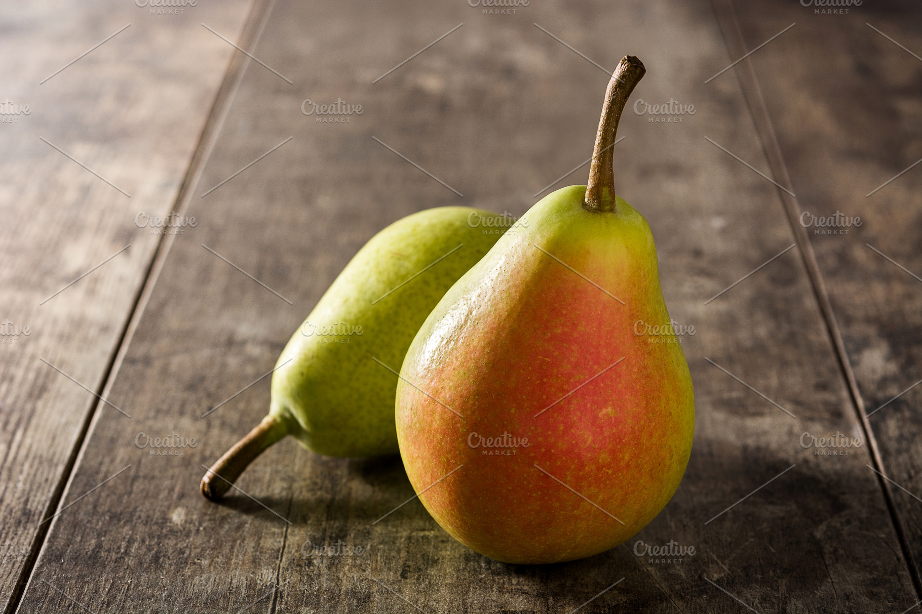 Fresh organic pears background. Ripe yellow large pears in wooden