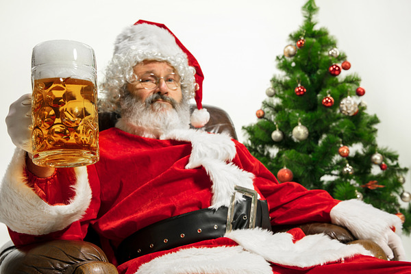 Santa Claus drinking beer near Chris | High-Quality People Images ...