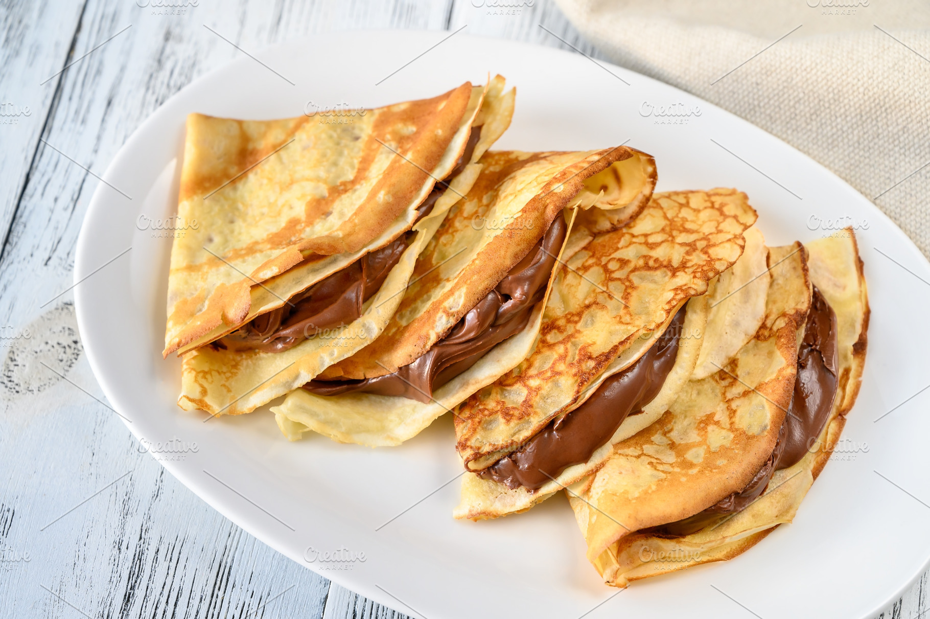 Crepes with chocolate cream | Background Stock Photos ~ Creative Market