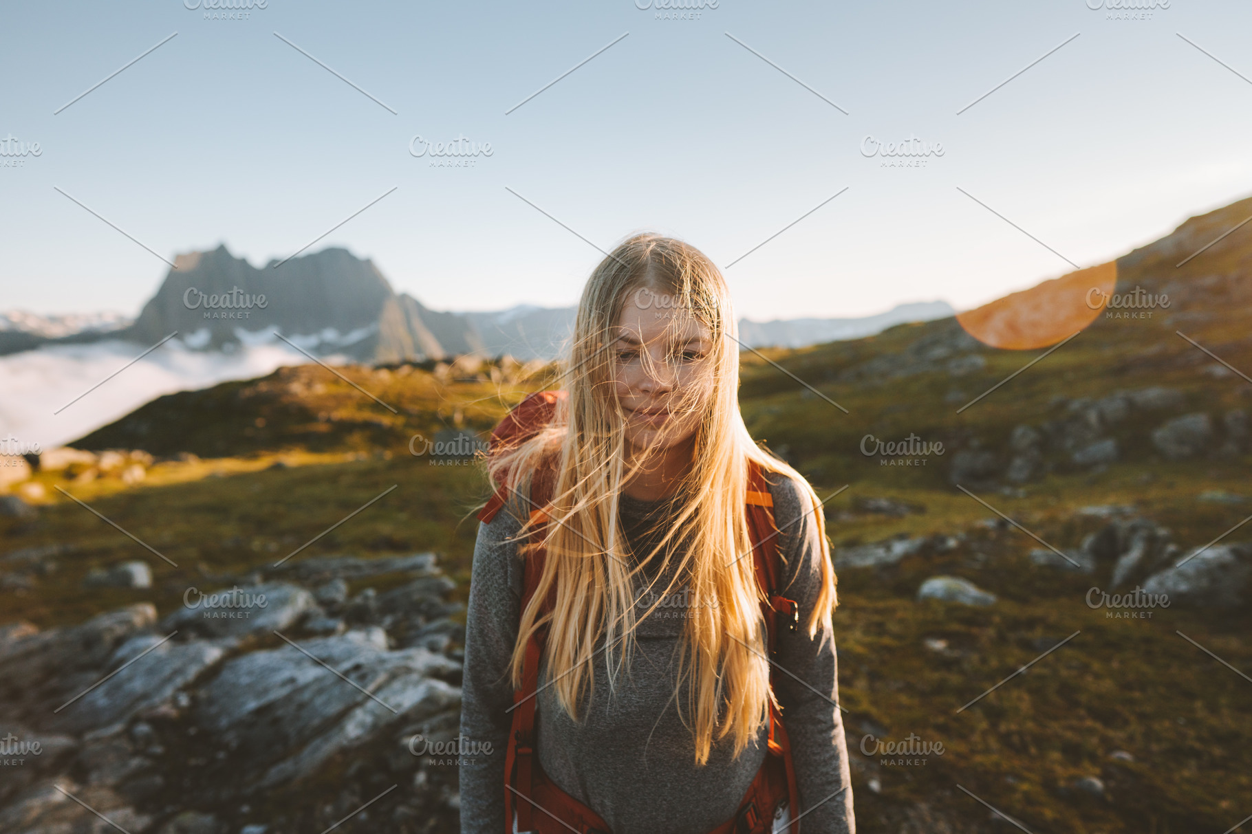 Woman hiking in mountains travel adv | People Images ~ Creative Market