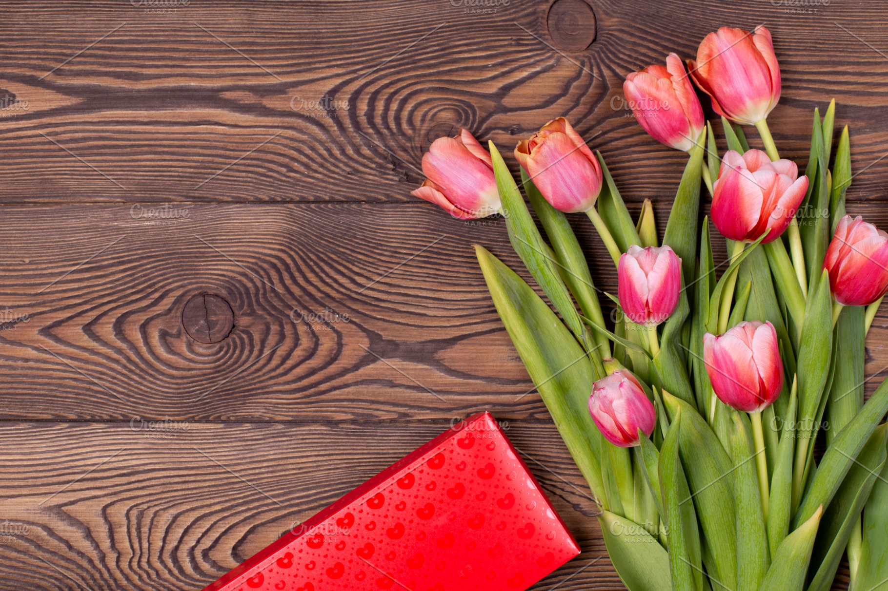 Gift box and tulip flowers on rustic featuring holiday, birthday, and ...