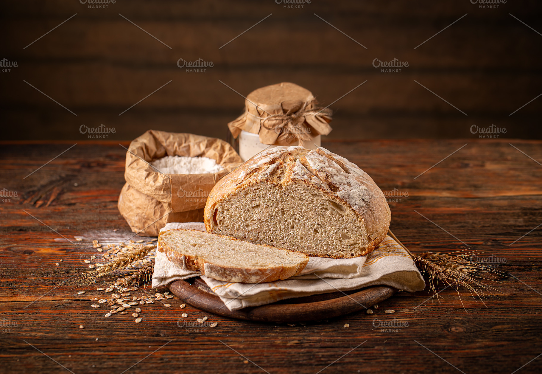 Sourdough bread slicing Stock Photo by grafvision