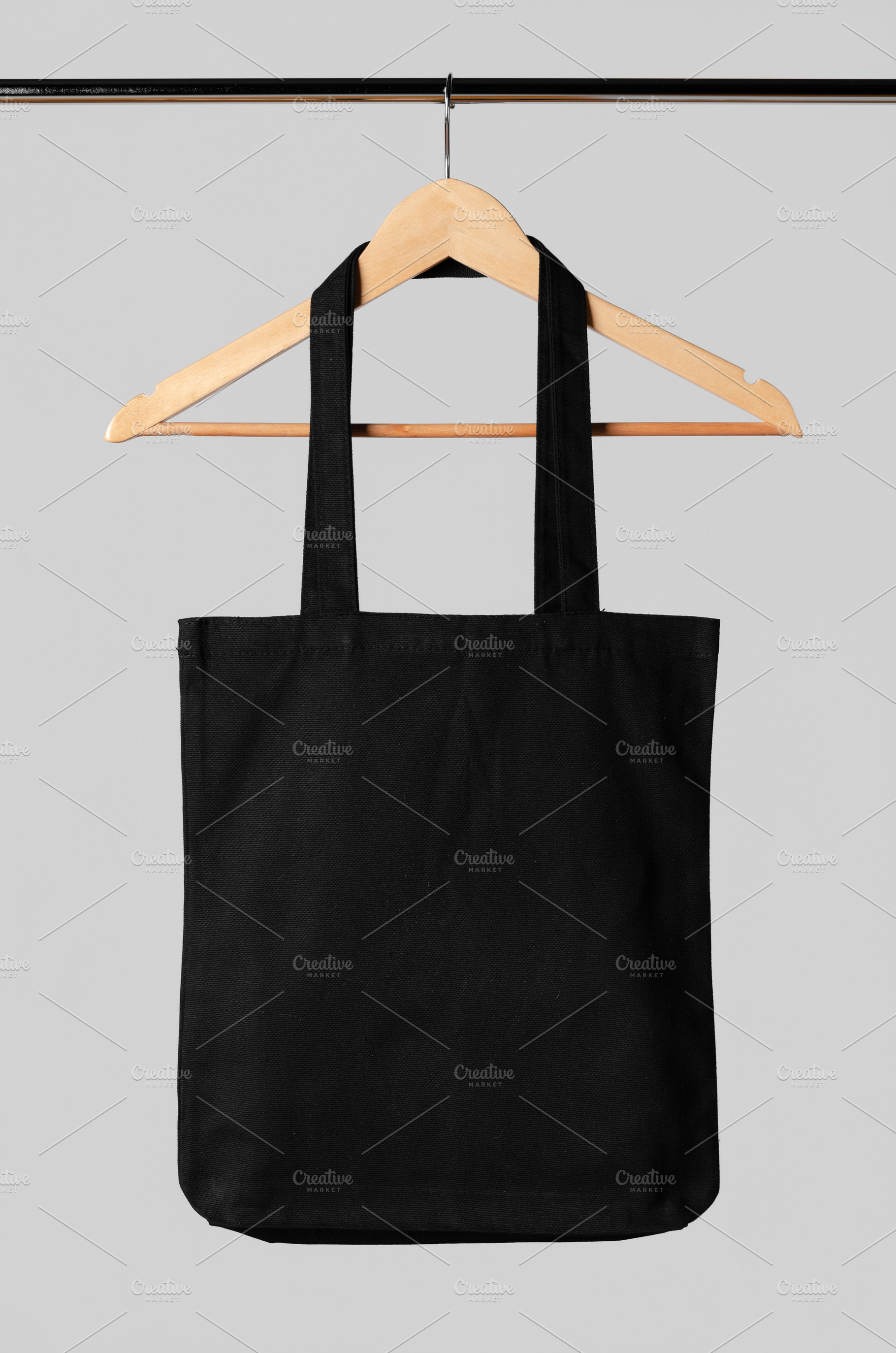 Download Black Tote Bag Mockup Hanging On A C High Quality Beauty Fashion Stock Photos Creative Market